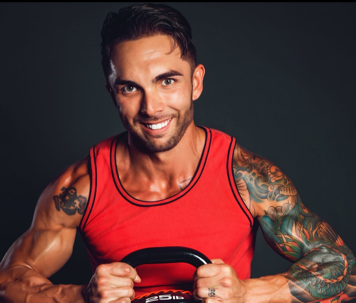 A personal trainer holding a kettlebell